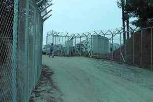 a fenced hotspot entrance, Chios